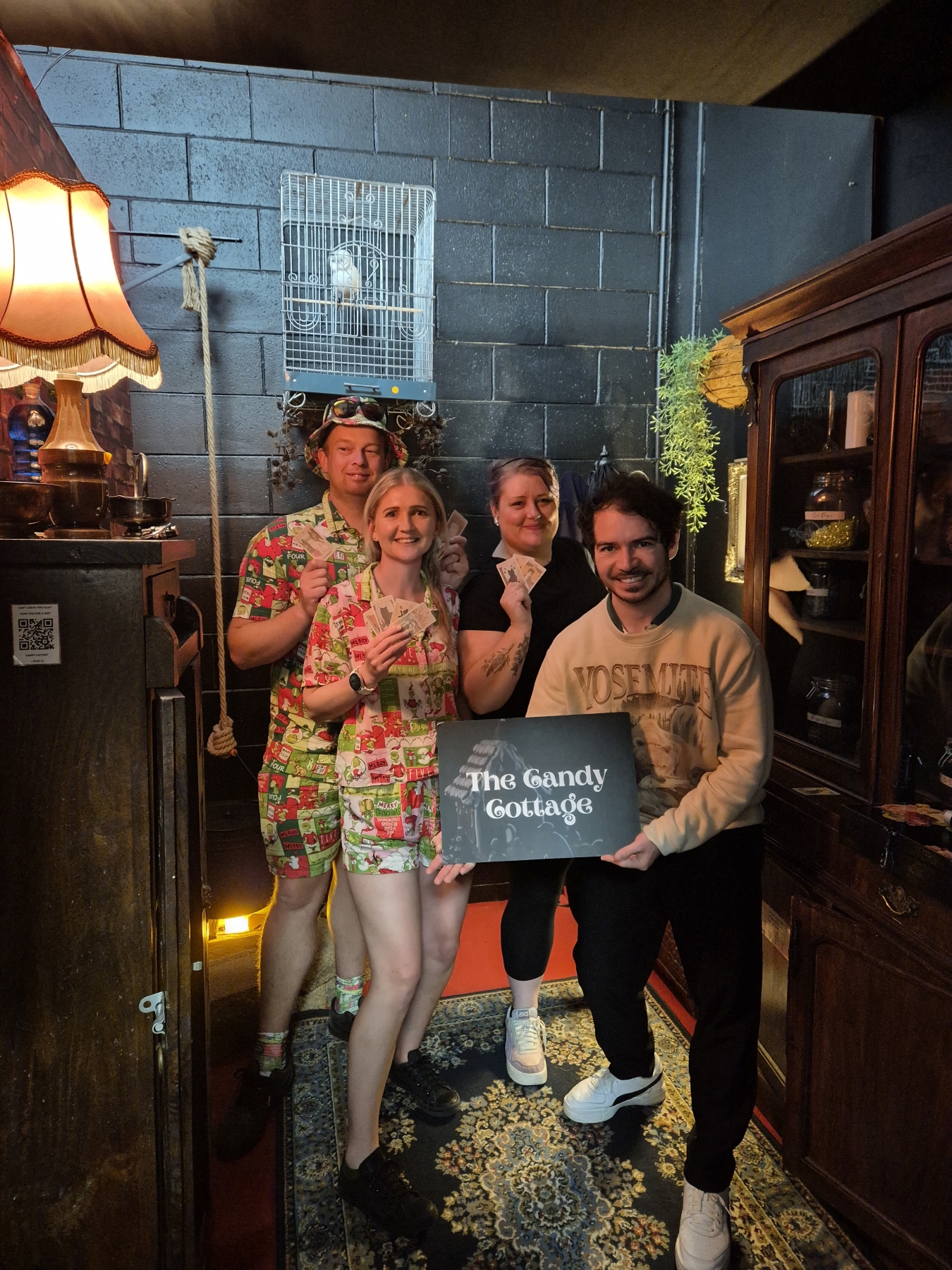 The Team Celebrating A Win At The Confinement Escape Room.