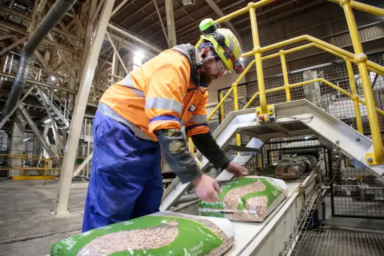 Staff Member Bagging Natures Flame Pellets